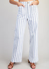 Person wearing blue and white striped pants on a plain background