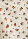 Pattern of horseshoes and flowers on a white background