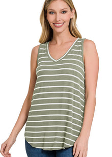  Woman wearing a green and white striped tank top on a white background