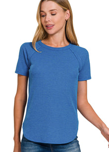  Woman wearing a blue t-shirt on a white background
