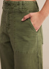 Green pants with a beige background