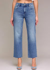 Blue jeans worn by a person on a plain background