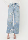 Floral-patterned denim wide-leg pants on a white background