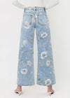 Floral-patterned jeans on a mannequin against a white background