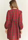 Red plaid dress worn by a person on a beige background