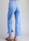 Light blue striped pants with ruffled cuffs on a plain background