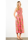 Woman wearing a pink floral dress on a white background