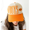 Orange and beige cap with 'BOYS' text on a white background