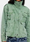 Green jacket worn by a person on a white background