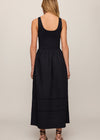 Black dress worn by a person on a plain background
